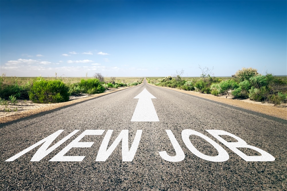 An image of a road to the horizon with text new job